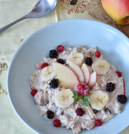 a stock image of oatmeal with a variety of fruit in it