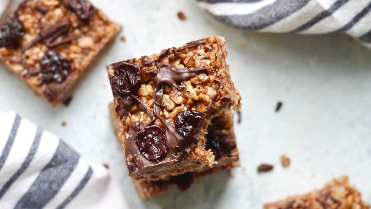 an image of chocolate covered rice crispy treats with dried cherries