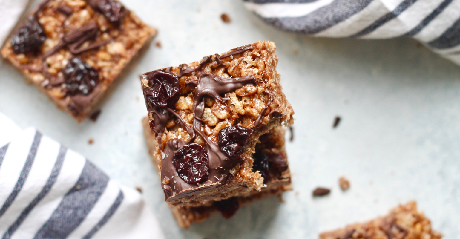 an image of chocolate covered rice crispy treats with dried cherries